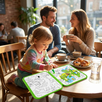 Animal World — toddler painting quietly at a sunny cafe table